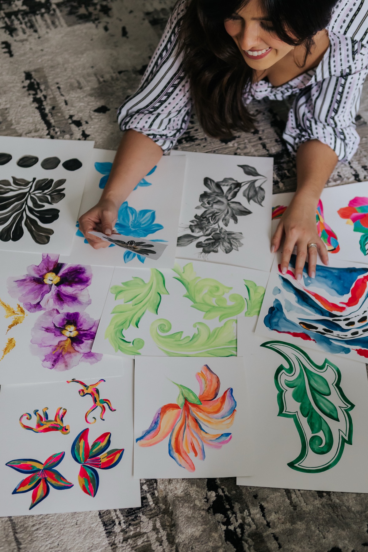 Finished prints spread across the studio floor